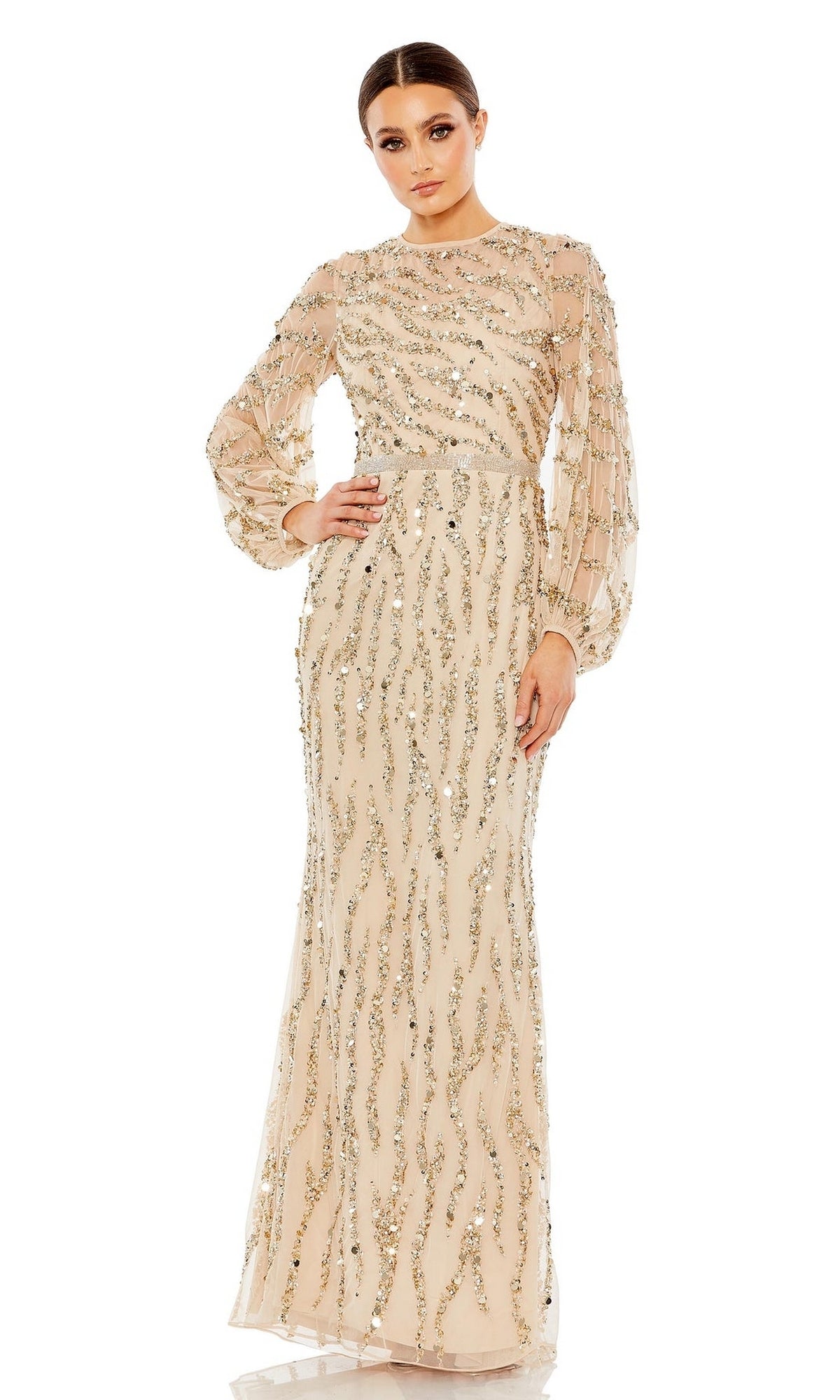 A woman wears the Mac Duggal 93789 Long Sleeve Gold Formal Dress, featuring elegant gold fabric with sequin accents—an ideal choice for a mother of the bride gown.